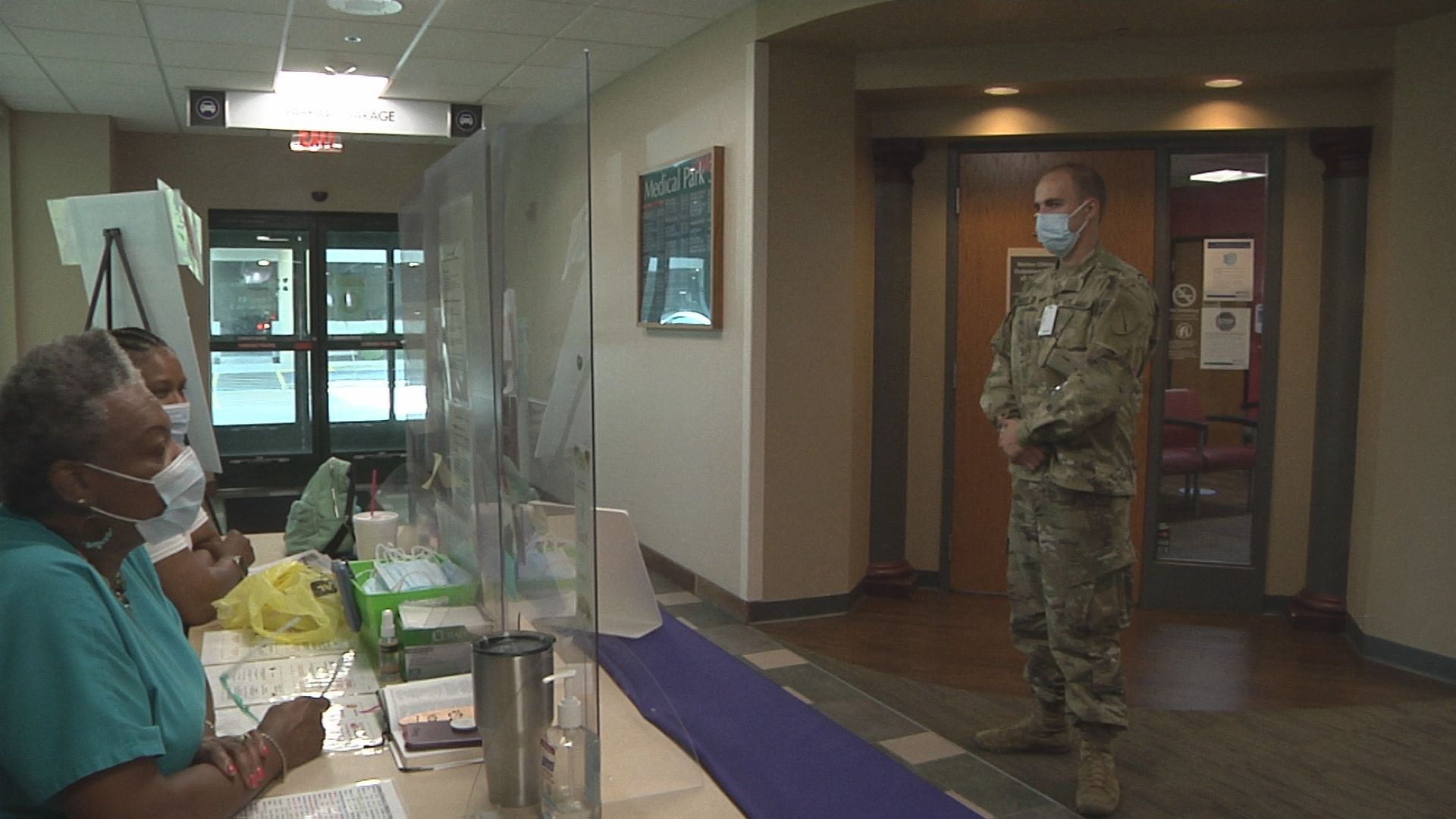 National Guard members greet people coming into Paducah hospitals